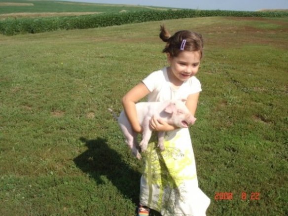 my sister trying to steal a piglet